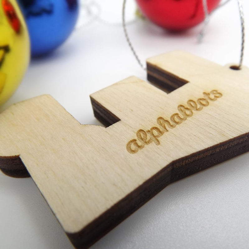 closeup back view typographic laser cut plywood letter e christmas tree decoration