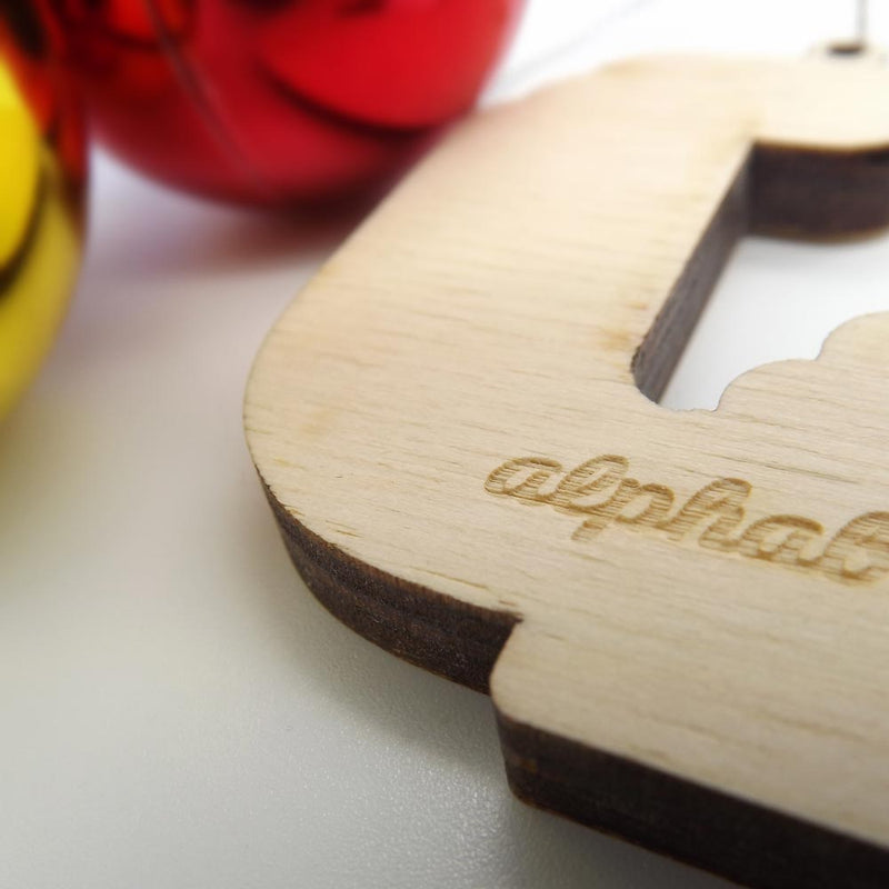 closeup back view typographic laser cut plywood letter j christmas tree decoration