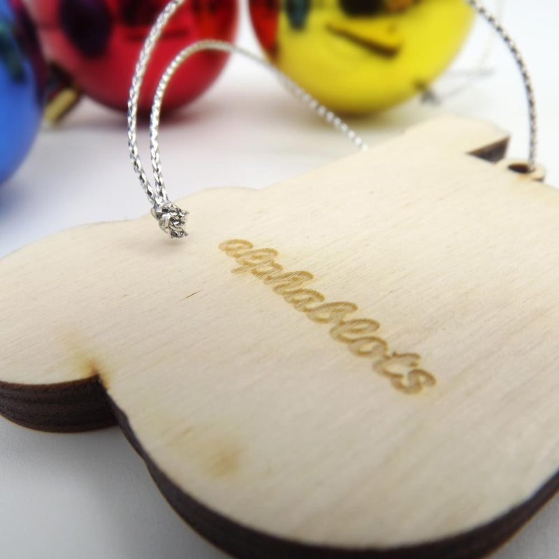 closeup back view typographic laser cut plywood letter u christmas tree decoration