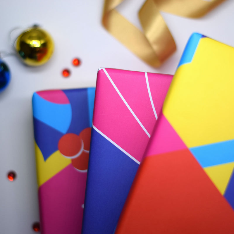 gifts wrapped in merry and bright wrapping paper